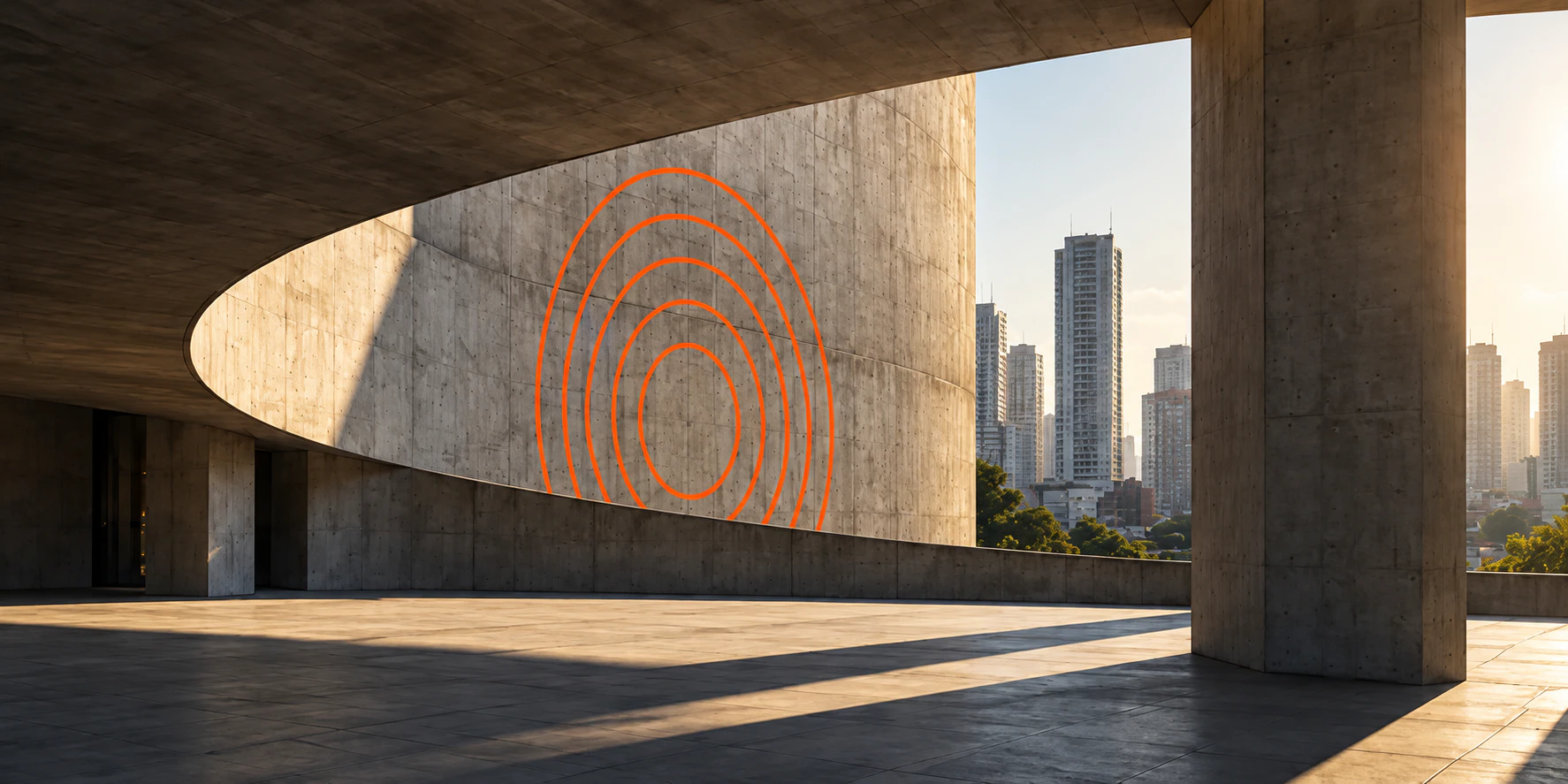 A São Paulo concrete building with the CRIA rings drawn in orange on its curved wall